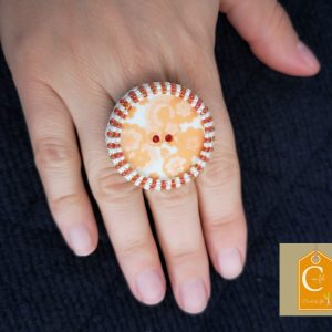 Bague orange et blanche bouton 2 trous